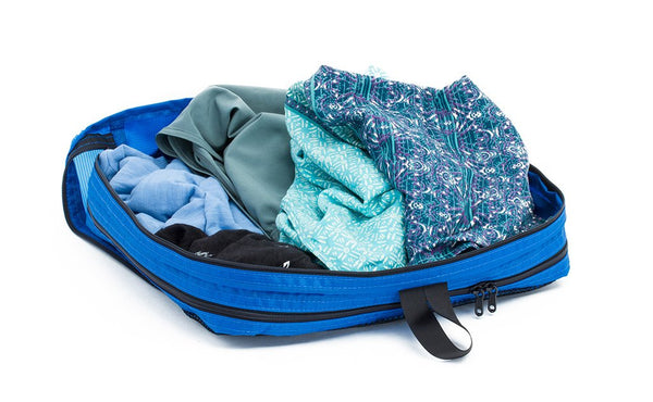 A filled and open Island (blue) Aether Large Aeronaut 30 Packing Cube showing the all-fabric side.